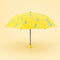 Parapluie enfant dinosaure jaune ouvert - packshot fond pastel