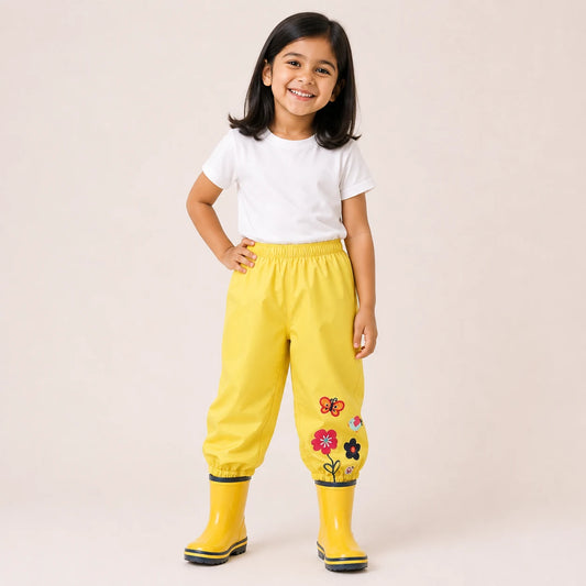 Pantalon de pluie jaune fleur brodee porte - packshot