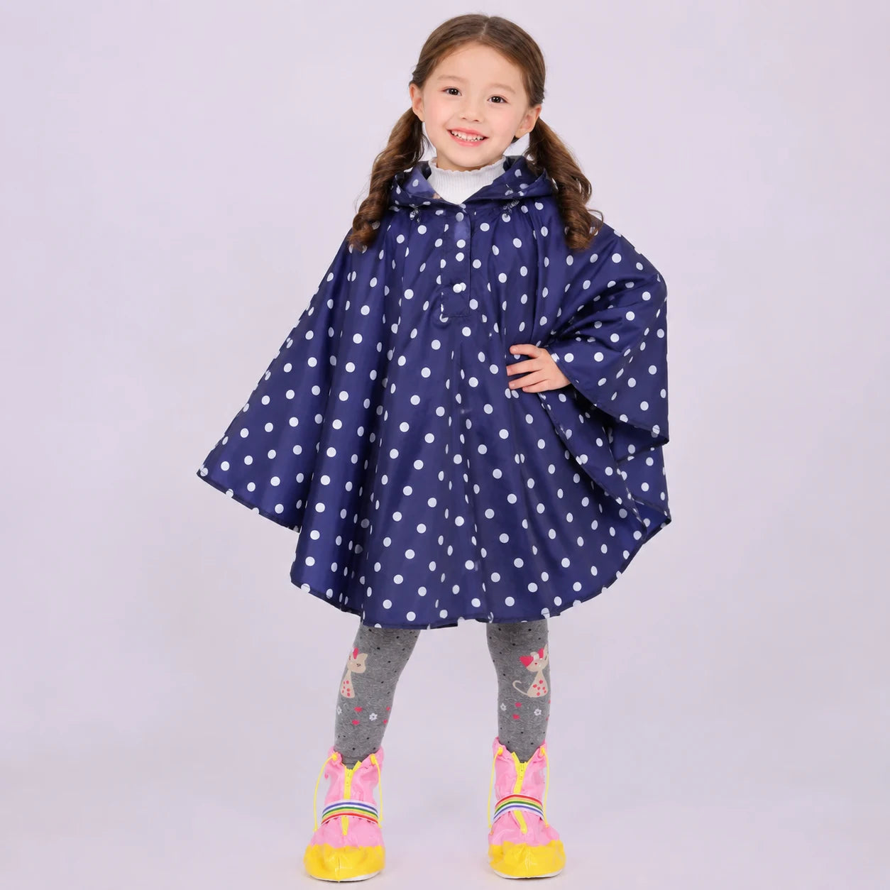 Poncho de pluie pois marine porte - packshot