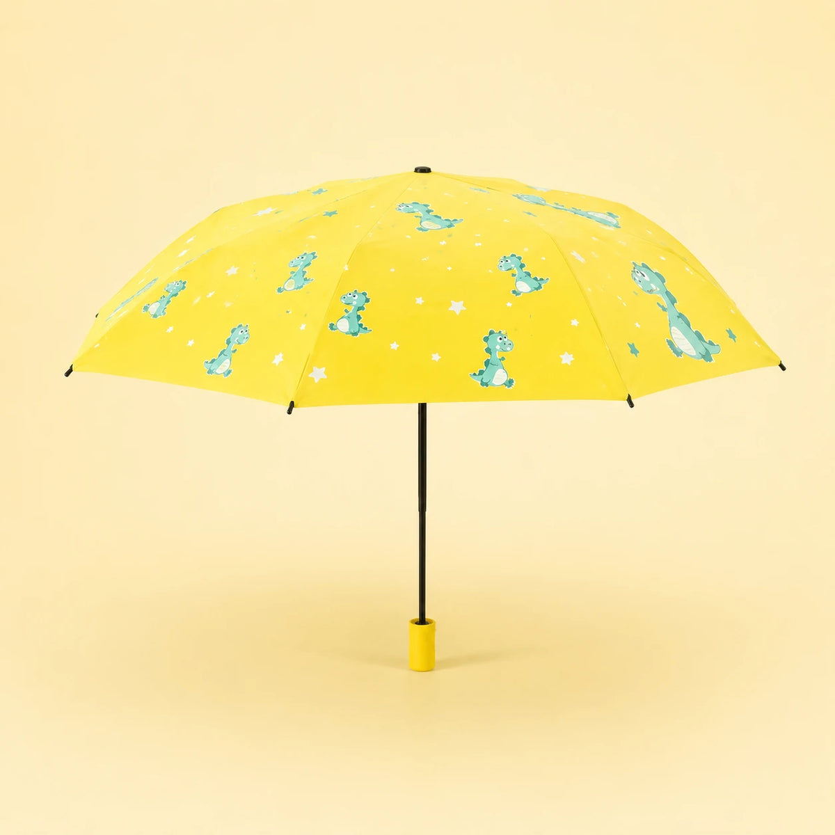 Parapluie enfant dinosaure jaune ouvert - packshot fond pastel