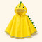 Poncho de pluie enfant a visiere dino jaune - packshot produit seul fond pastel