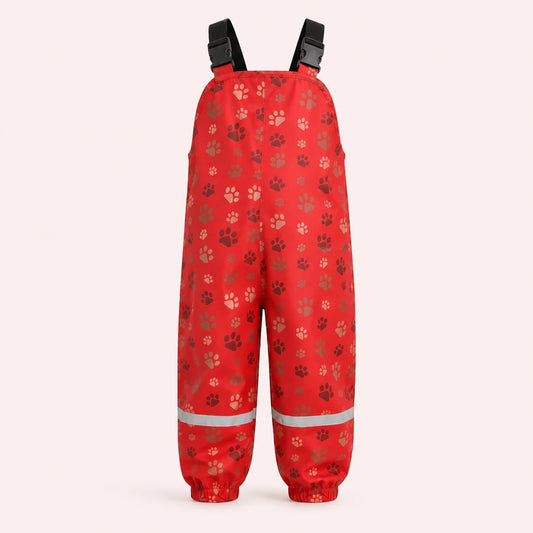 Salopette de pluie enfant rouge motif pattes - packshot produit seul